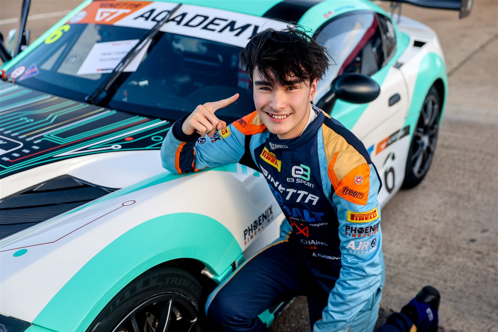 Andrew Robinson beside his Ginetta G56 GTA race car
